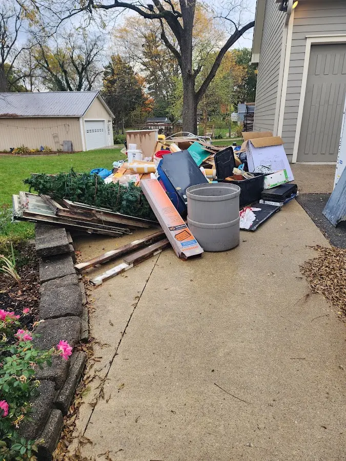 Dumpster being loaded with debris for 10 Yard Dumpster Rental in Union City